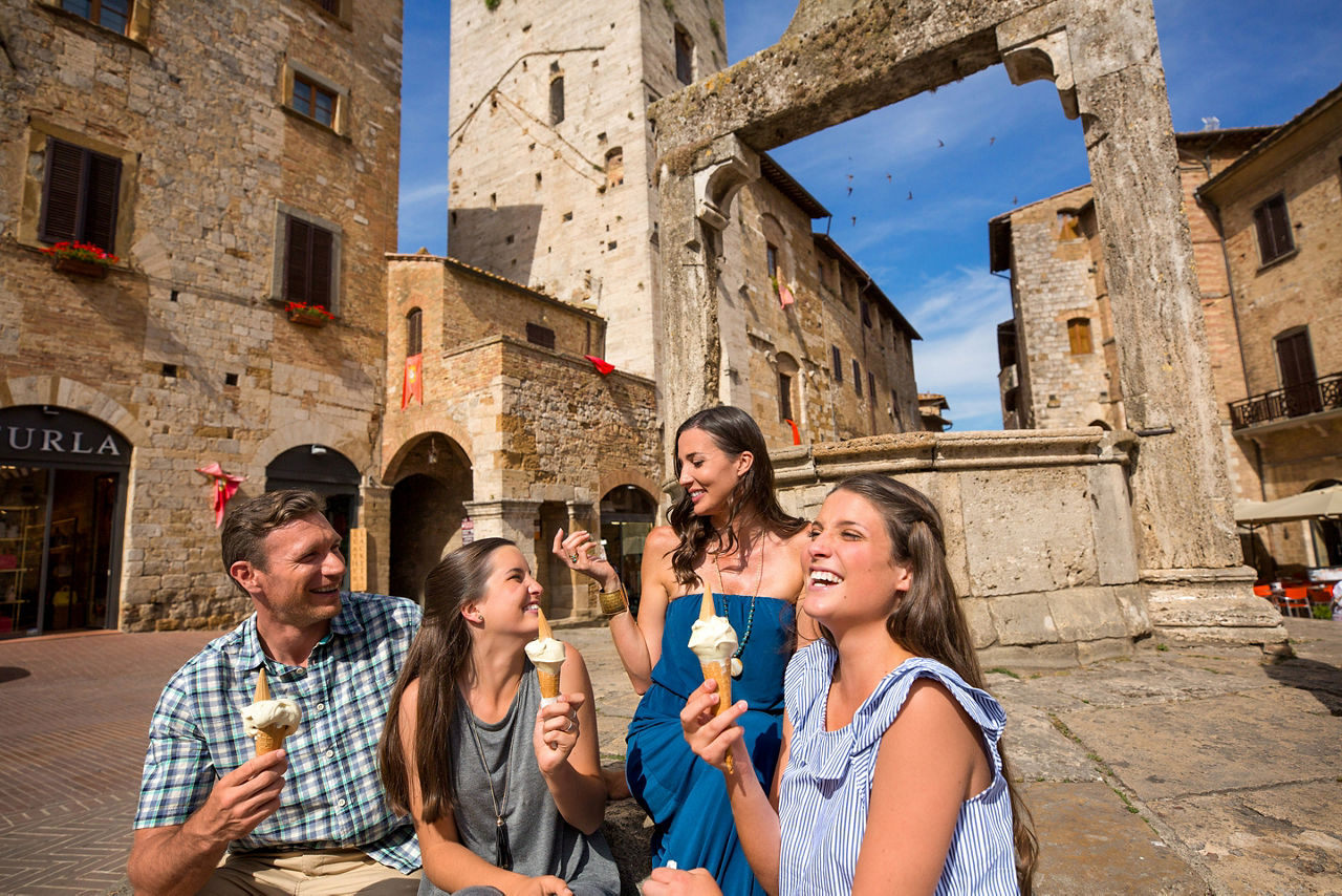 Family having gelato in a plaza in Florence, Italy 
