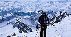 Male Backcountry Skier Skiing Down High French Swiss Alps
