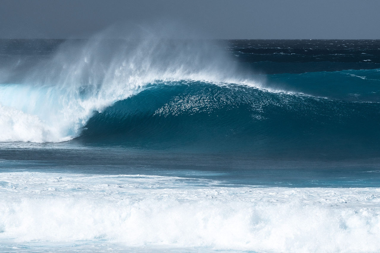 Banzai Pipeline wave at local surf spot. Oahu, Hawaii.