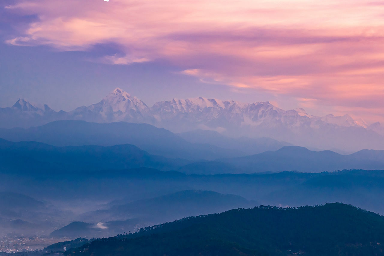 Panoramic landscape of great Himalayas mountain range during an autumn morning from Kausani also known as 'Switzerland of India' a hill station in Bageshwar district, Uttarakhand, India