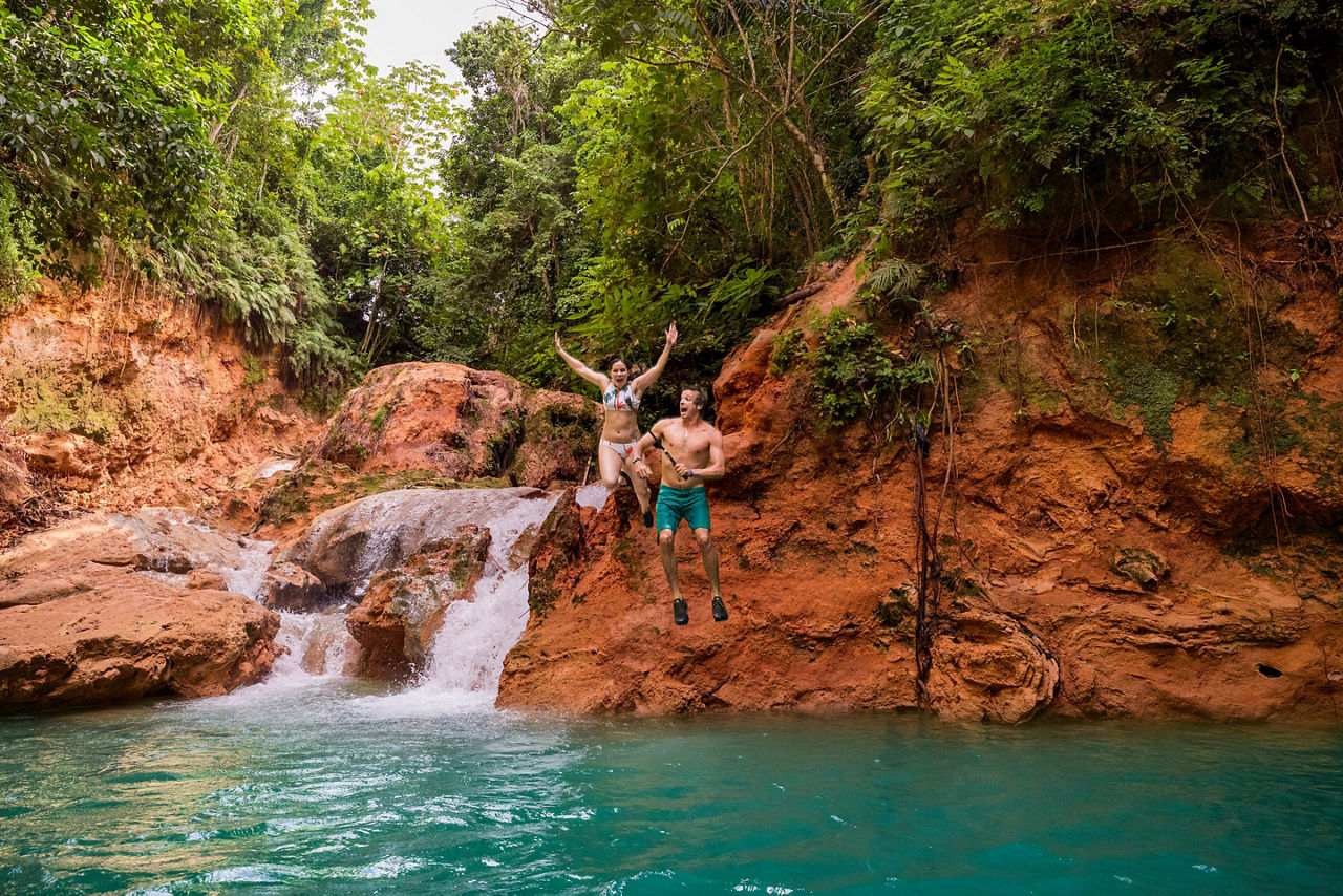 Jamaica Ochos Rios Couple Jumping in Blue Hole