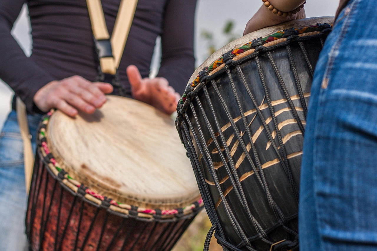 People Playing Djembe Drums