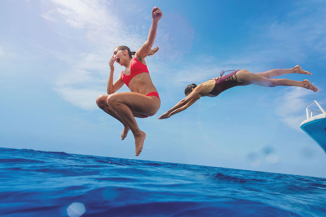 Cozumel, Mexico Girls Jumping into Ocean