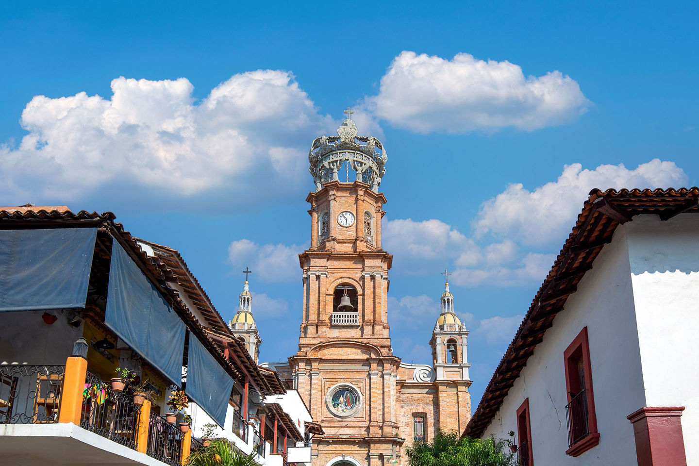Lady of Guadalupe Church tower rising above Puerto Vallarta’s Malecón. - Puerto Vallarta, Mexico