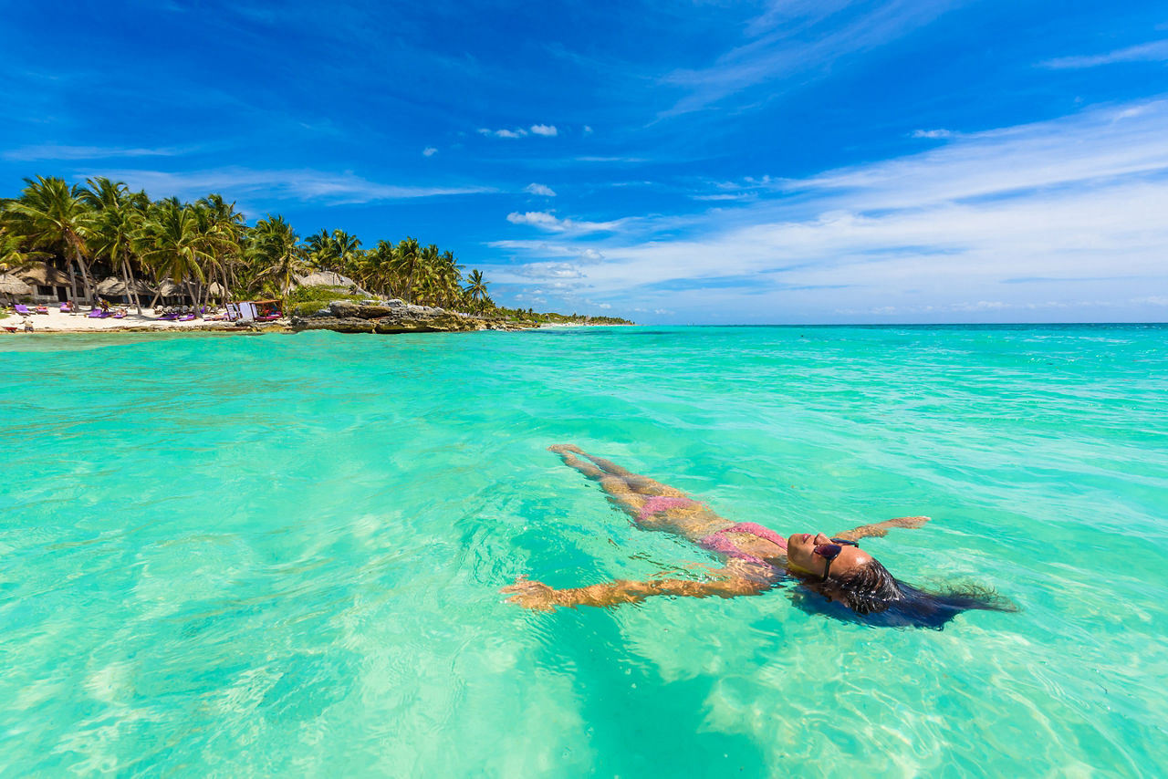 Woman Swimming in the Ocean, Tulum Mexico