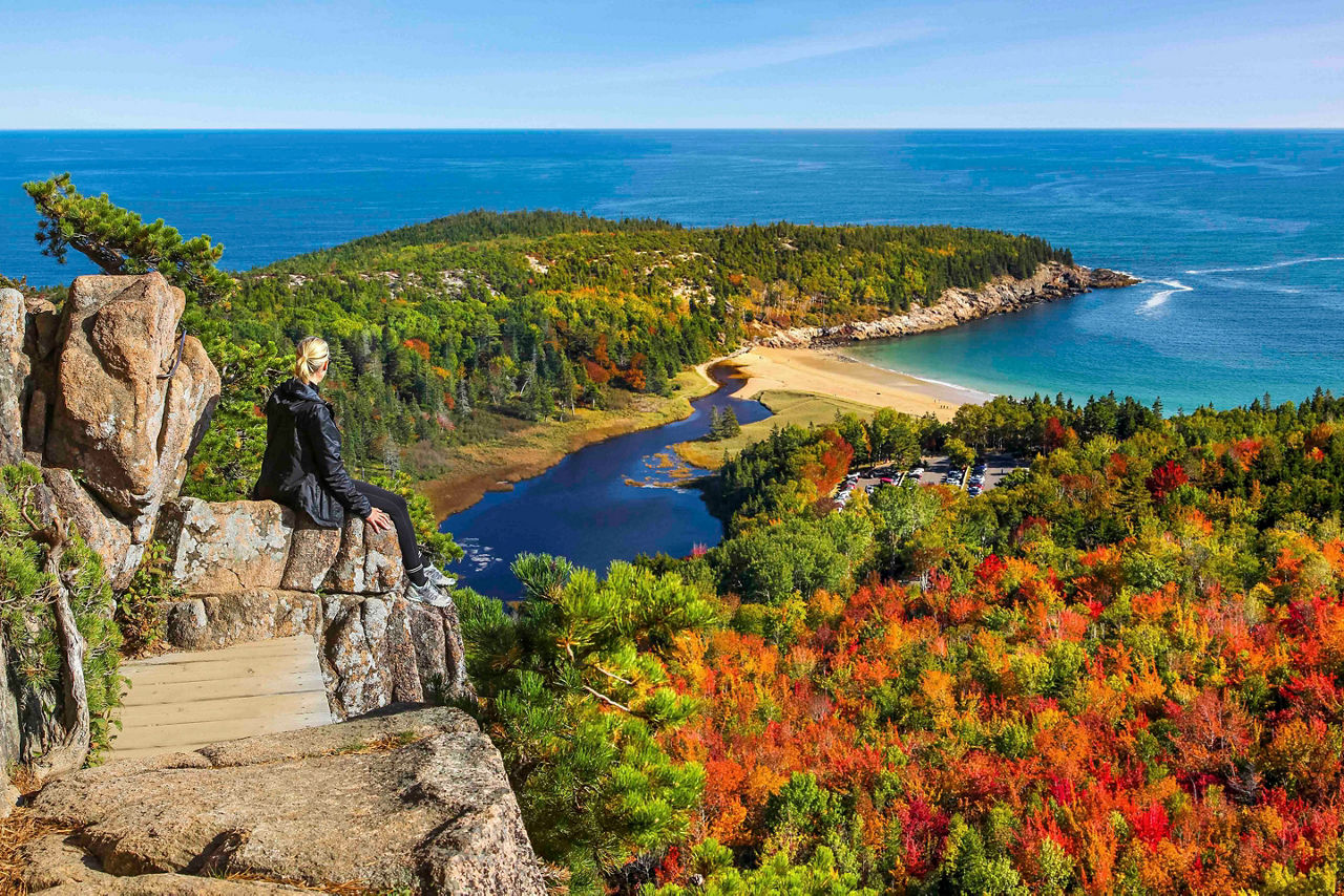 Maine Acadia Woman Enjoying The View Of Fall Foliage And The Ocean