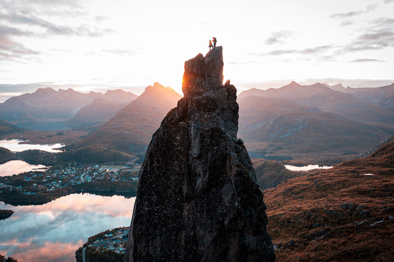 View of two People Rock Climbing to the Top of Lofoten. Norway