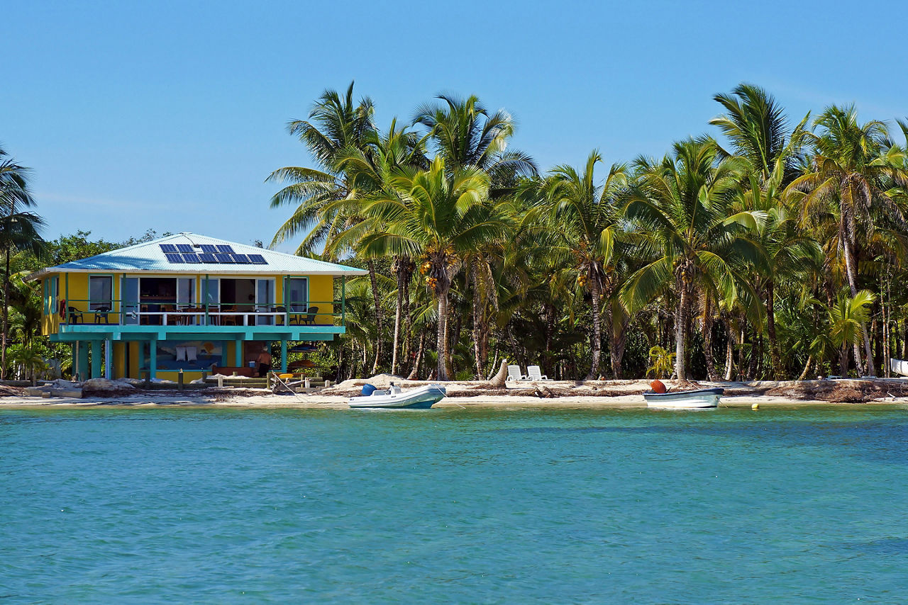 Solar powered beach house and coconut trees. Panama