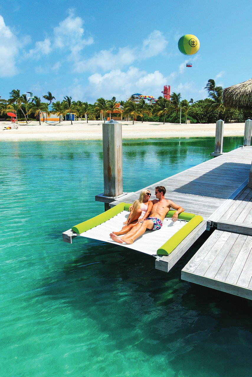 Coco Beach Club Overwater Cabana Couple sunbathing