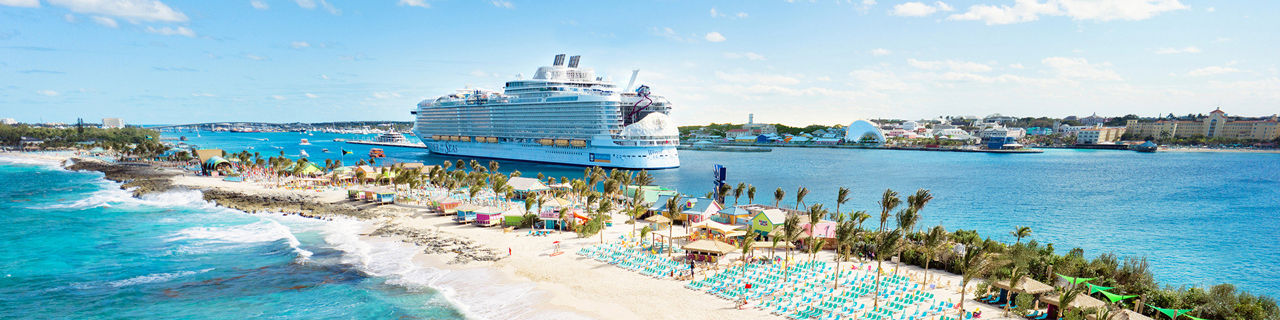 Aerial of Chill Beach with the ship in the background at Royal Beach Club Paradise Island.