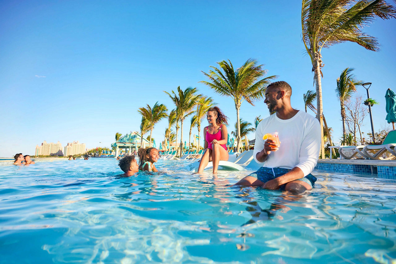 Family at the Deep End Pool in Paradise Beach at Royal Beach Club Paradise Island.