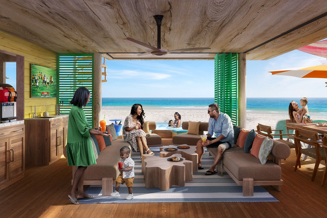 Living room of ultimate family cabana with people sitting around conversing