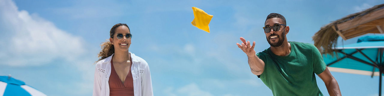 Royal Beach Club Paradise Island, African American playing cornhole,