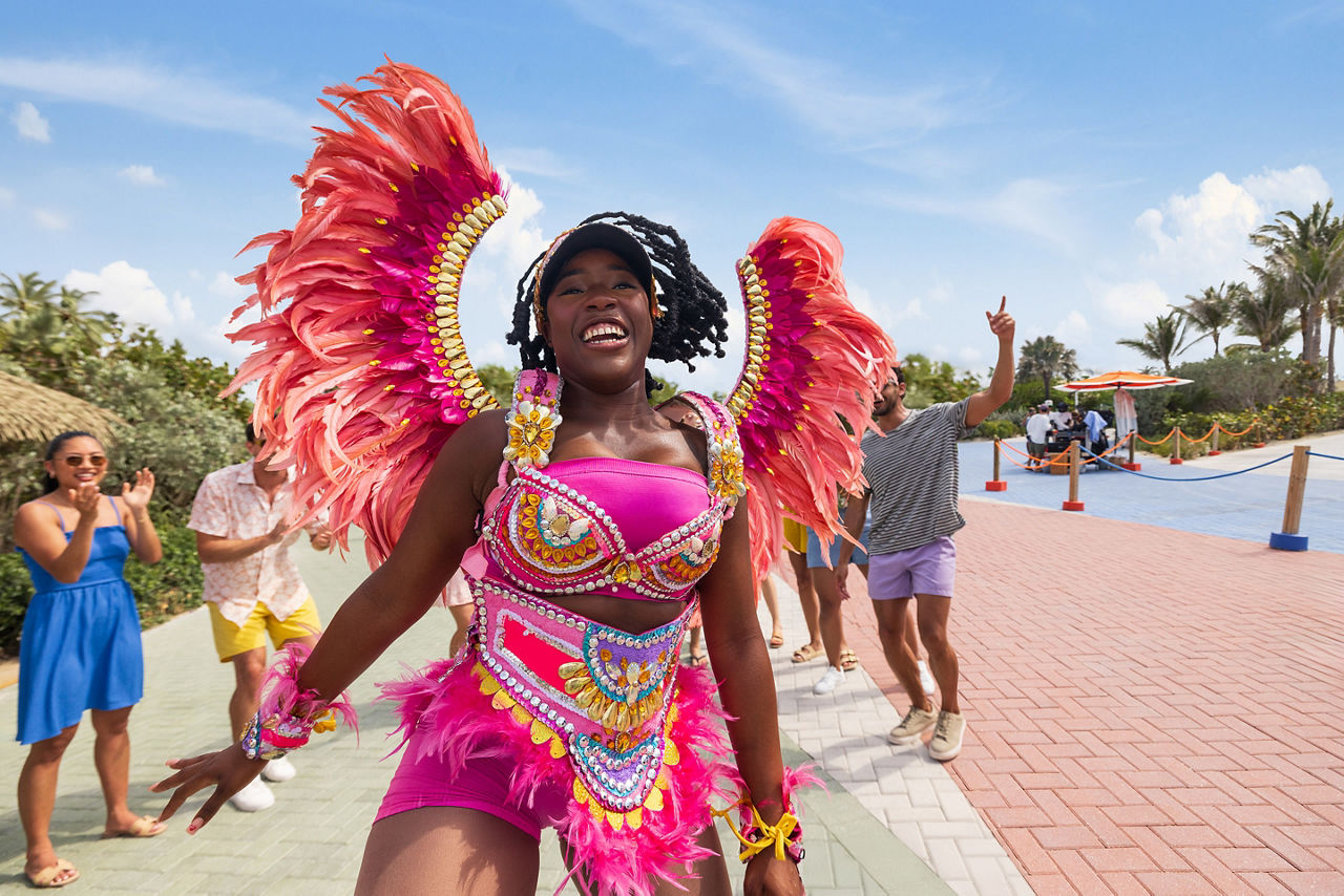 RBC Paradise Island, woman performer with colorful clothes