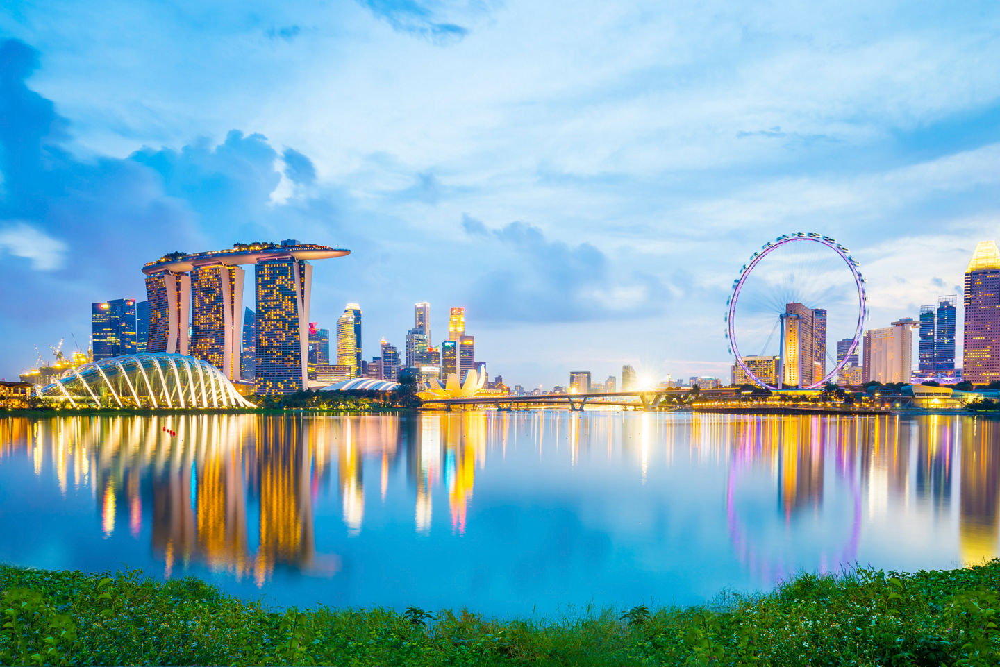 Singapore’s iconic skyline and Marina Bay glow at sunset, blending nature and modernity. - Singapore, Singapore