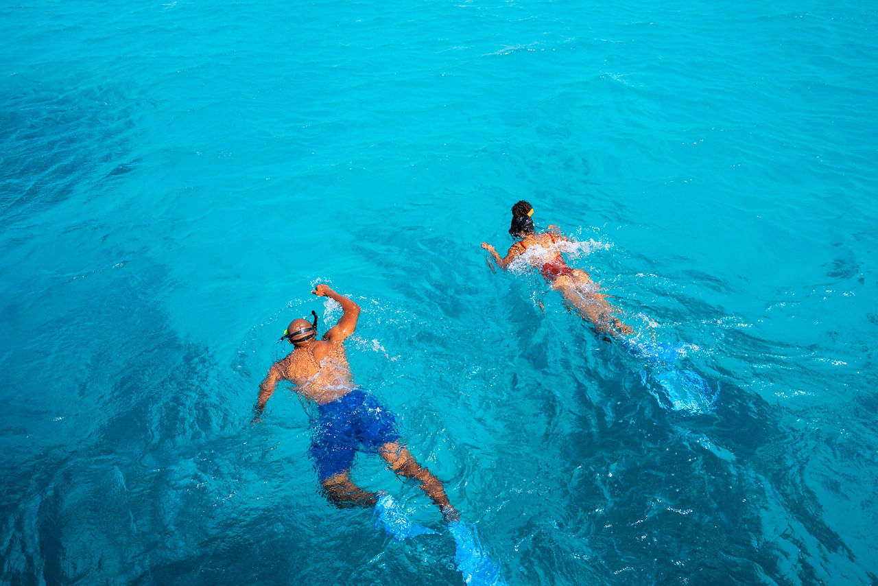 Bonaire Couple Snorkeling in Clear Blue Ocean