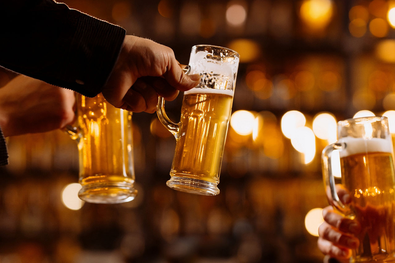 Liming with friends while holding stag beer