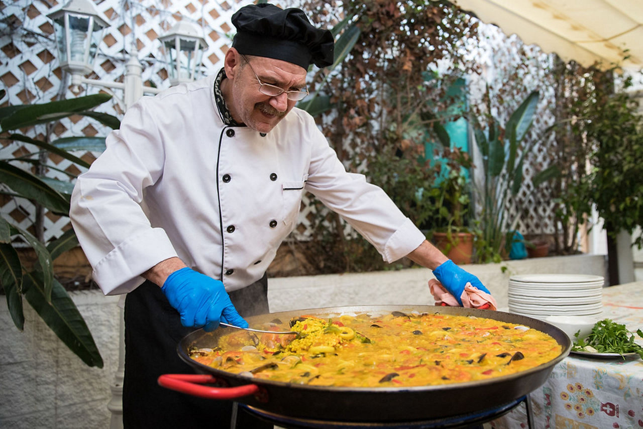 Spain Local Chef Cooking Paella