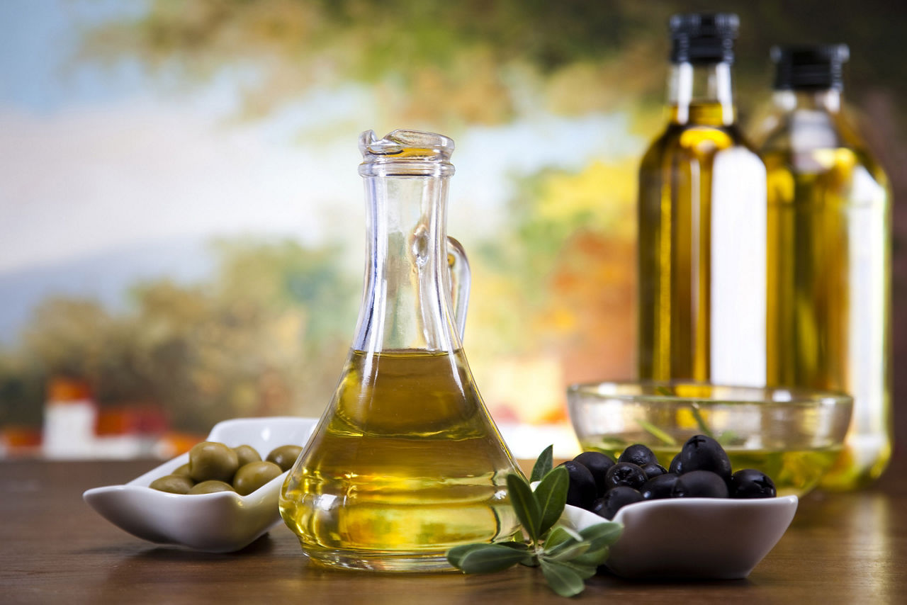 Olive Oil Bottles with Olives 