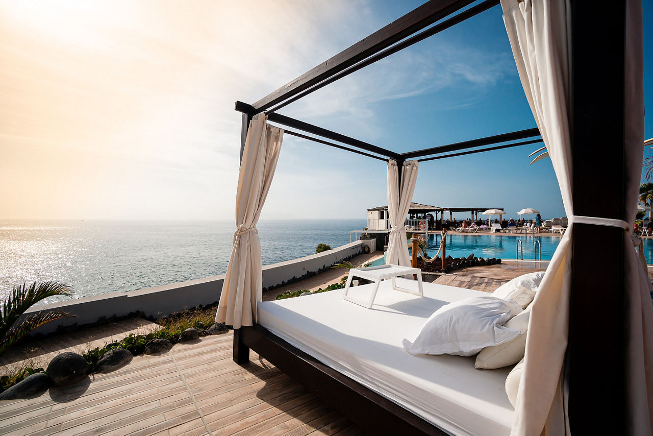 sunbathing bed in a luxury pool hotel with stunning ocean views SHA Wellness Clinic resort