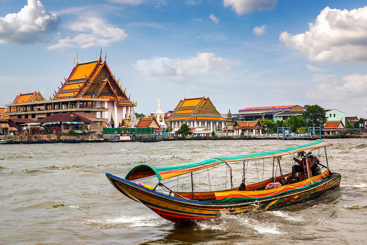 Boat traveling via the Chao Phraya River. Bangkok Thailand.