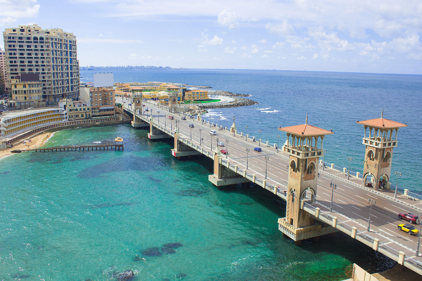  Stanley Bridge arches over Alexandria’s sparkling waterfront on a clear day. - Alexandria, Egypt