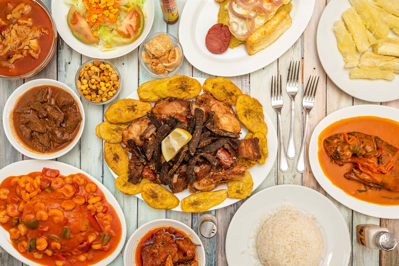 Typical dishes from the Dominican Republic, mofongo with prawns, picatodo, encocado fish, fried cassava and moro rice