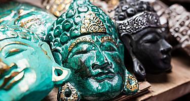 Traditional ancient mask souvenirs and handicrafts of Bali at the famous Ubud Market.