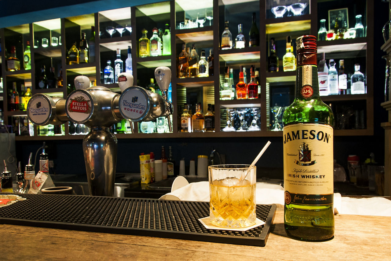 Whiskey business a shelf full of alcohol drinks