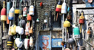 Collection of Vintage Buoys in Fishing Village