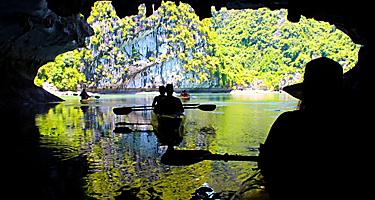 Silhouettes Couple Kayaking Inside a Cave