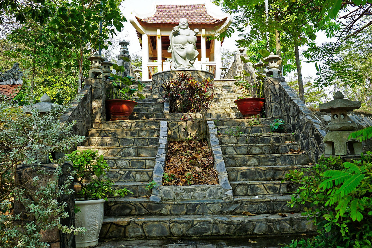 A stone stairway leads to a traditional temple in Bien Hoa, offering a glimpse into the cultural and spiritual heritage of the Dong Nai region near Phuoc An.