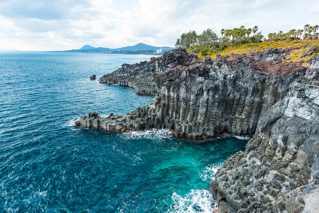 Stone columns make up the unique Daepo Jusangjeolli Cliff on Jeju Island.
