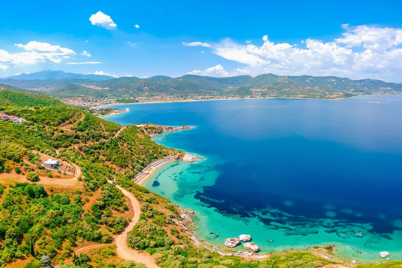  Aerial view of sand beach and blue water near Kavala, Greece, Europe