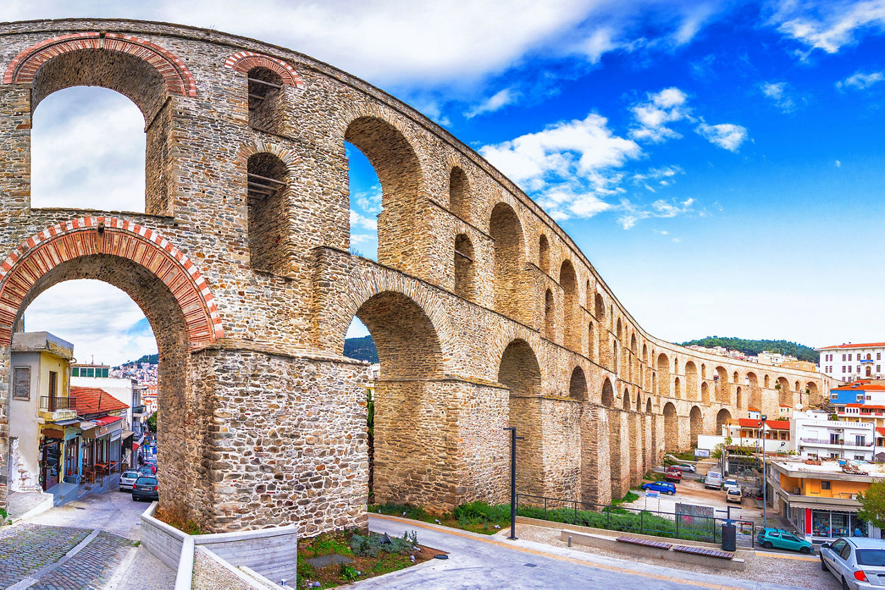 Cityscape with medieval aqueduct Kamares in the Kavala city, Macedonia, Greece.