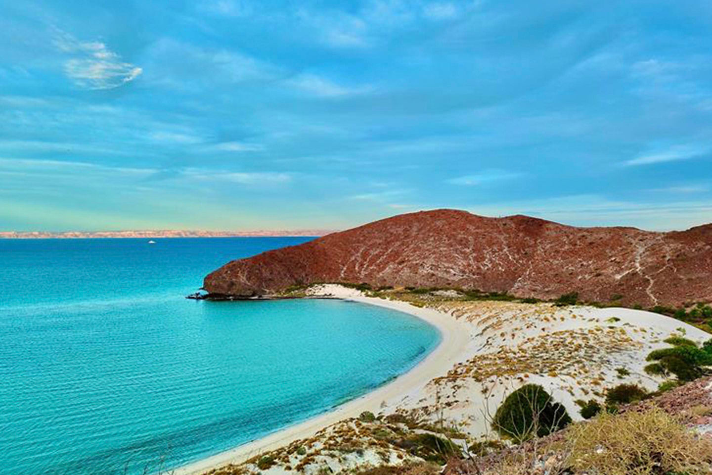 Clear turquoise water surrounds Balandra Beach. - La Paz, Mexico