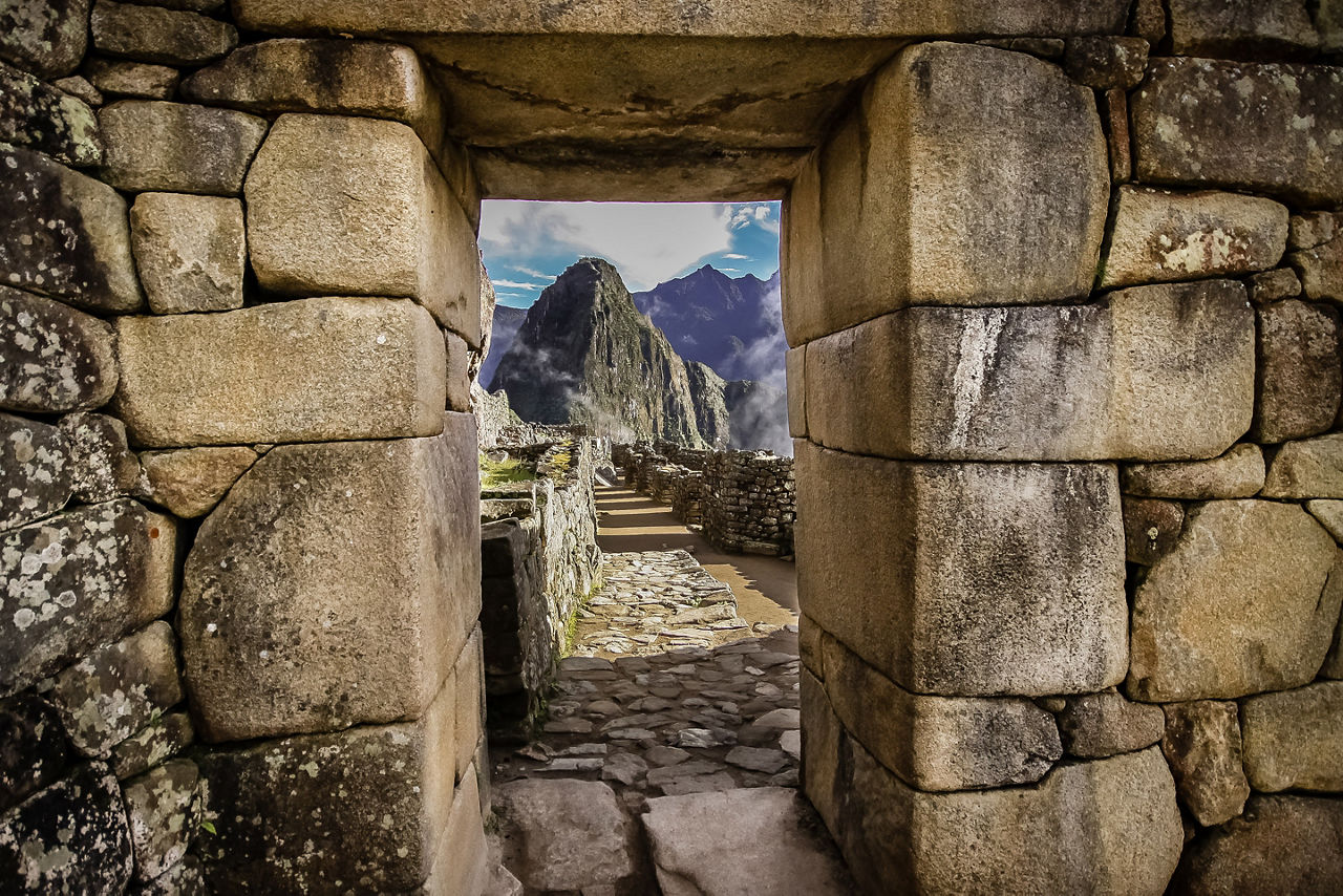 Doorway at Machu Picchu frames a view of Huayna Picchu, Machu Picchu, Unesco World Heritage site, Sacred Valley, Peru