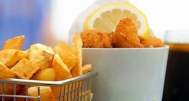 Home made scampi and chips served with mushy peas, English traditional menu