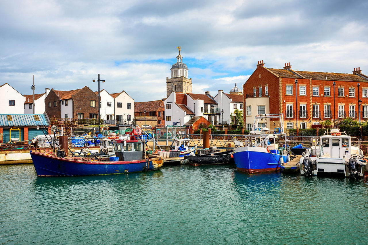 Fishing boats in the boat harbour in Portsmouth Old town center, England, United Kingdom