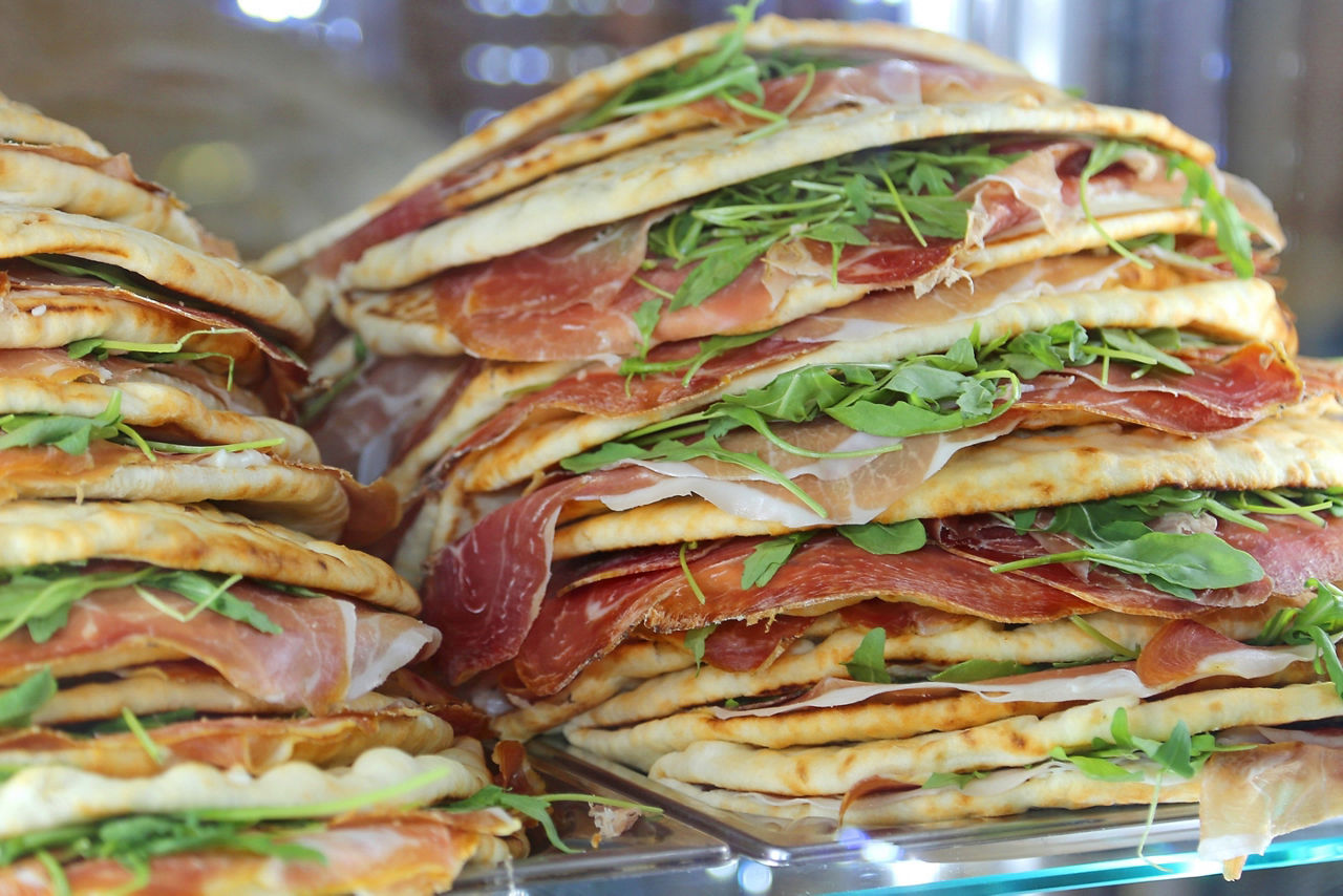Appetizing piadina stuffed for sale in the restaurant in central Italy