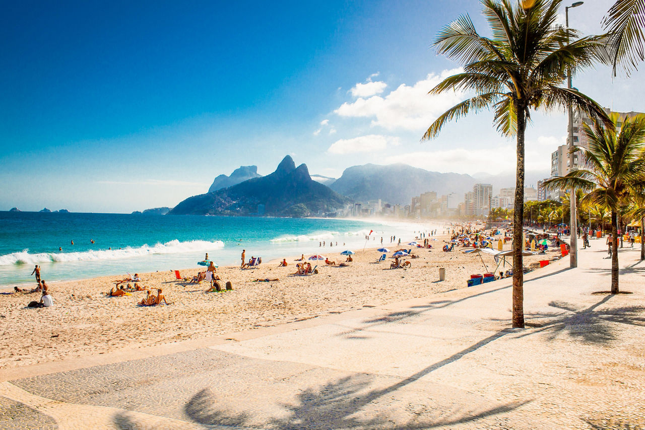 Palms and Two Brothers Mountain on Ipanema beach in Rio de Janeiro. Brazil.