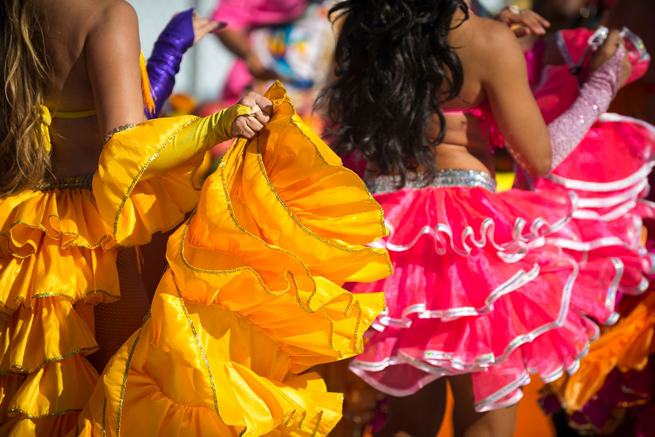 Carnival costumes dancing in bright sunlight in Rio de Janeiro, Brazil