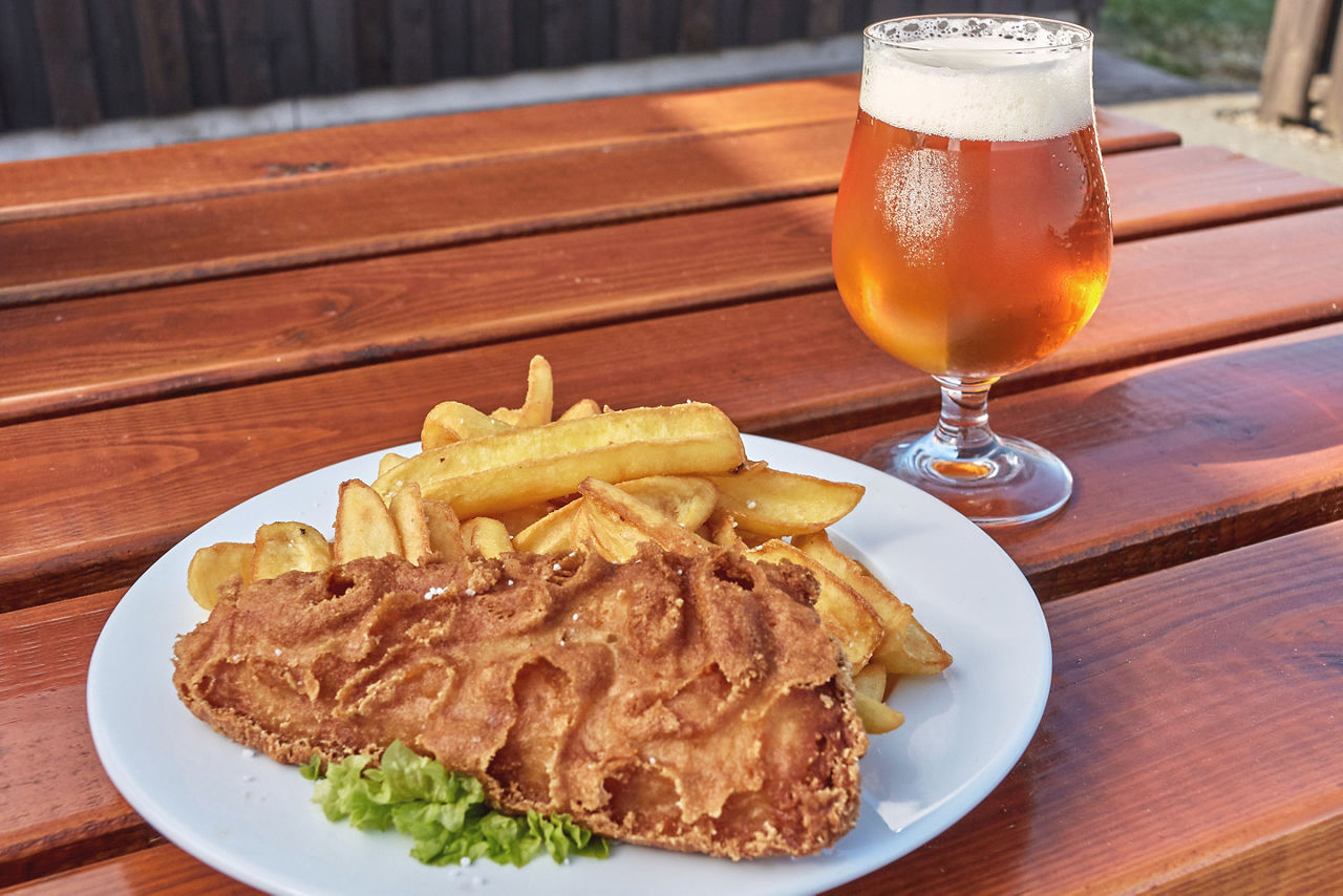 Fish and chips plate and a glass of beer