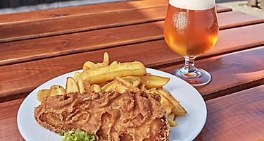 Fish and chips plate and a glass of beer