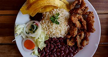 Nicaragua typical plate. Meat with rice and beans