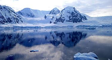 Extreme weather, scenic view of antarctica sea from a ship, snow and mountains.