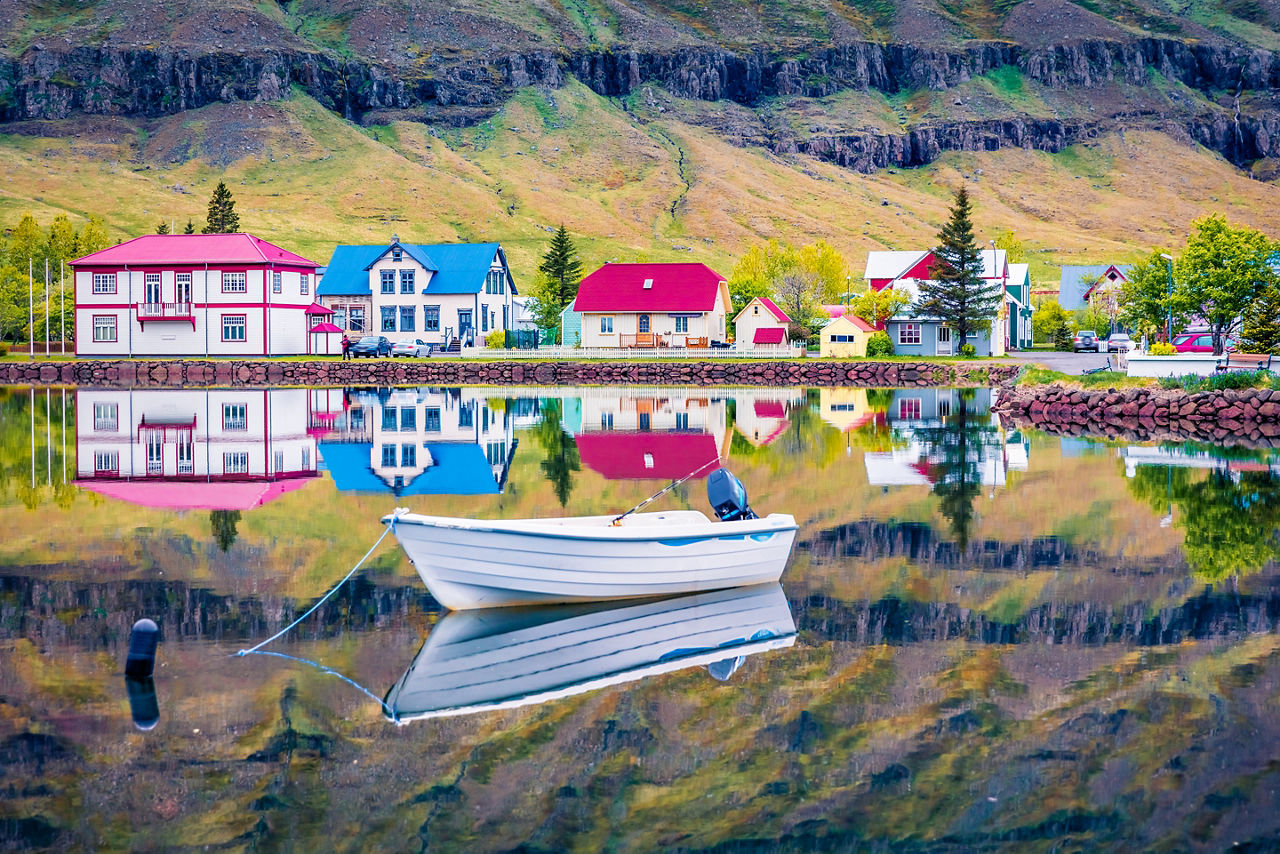 Colorful morning cityscape of small fishing town - Seydisfjordur. 