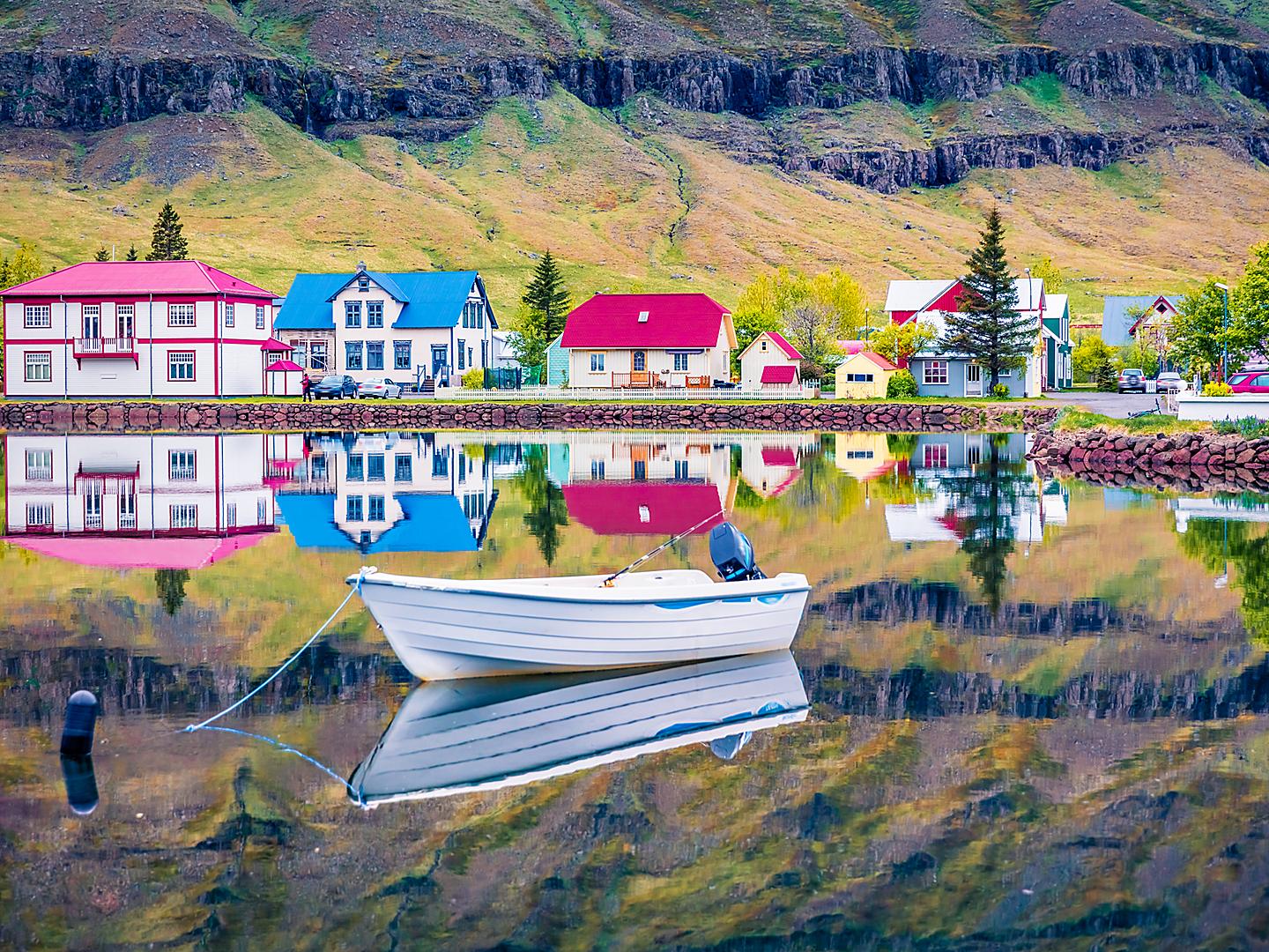 Colorful morning cityscape of small fishing town - Seydisfjordur. 
