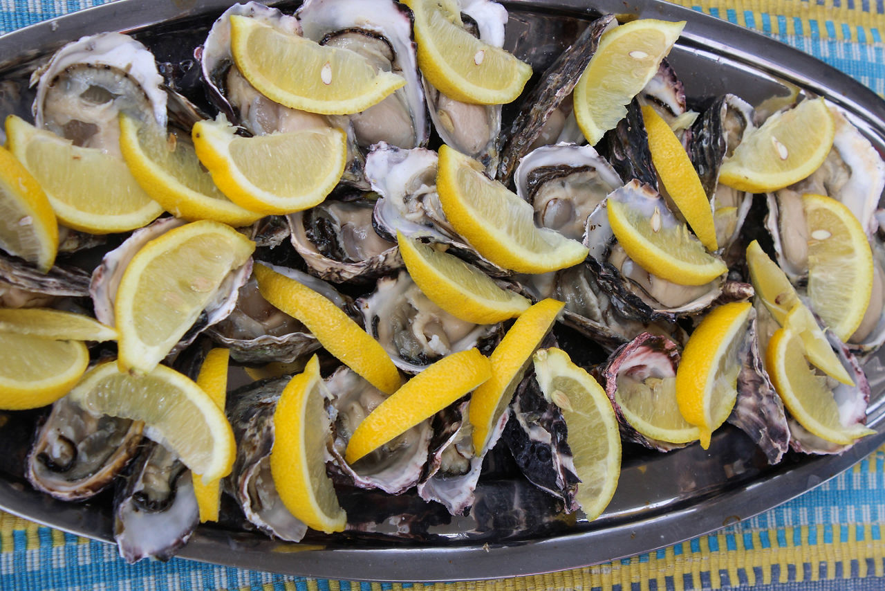 Plate with fresh oysters and lemon