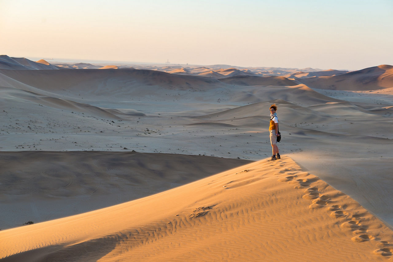 Tourist walking on the scenic dune 7 at Walvis Bay